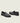 Men's black Italian leather penny loafer dress shoe with black sole.